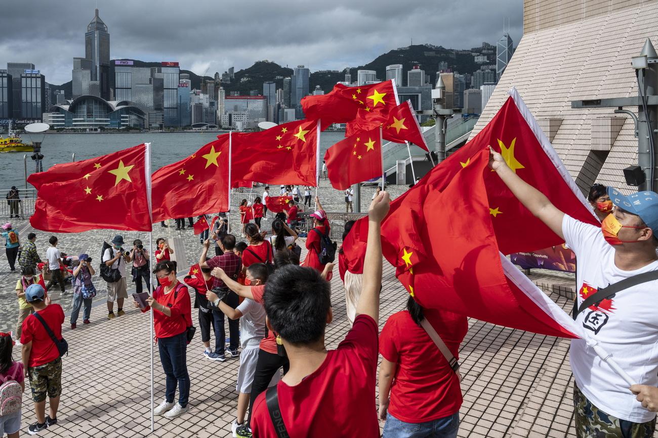 Des habitants ont célébré cette date historique pour Hong Kong. [Keystone - Miguel Candela]
