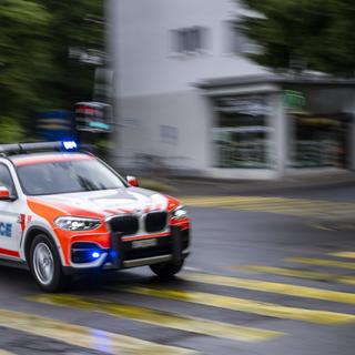 Une voiture de la police genevoise. [Keystone - Martial Trezzini]