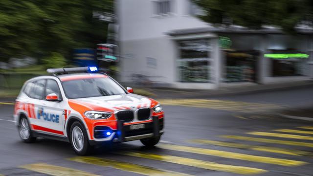 Une voiture de la police genevoise. [Keystone - Martial Trezzini]