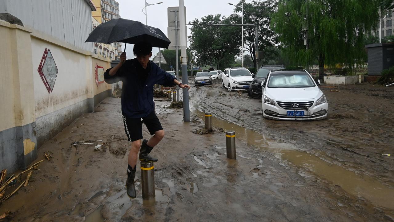 Des inondations à Pékin font au moins 11 morts et 27 disparus. [AFP - PEDRO PARDO]