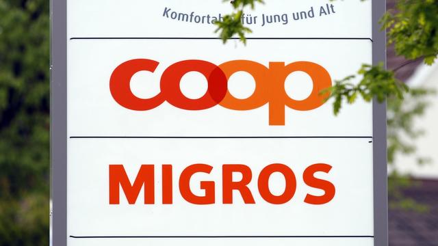 Coop et Migros. [Keystone - Patrick B. Kraemer]