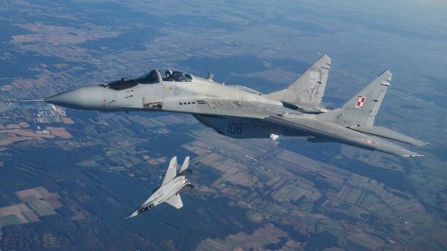 Deux avions de combat MiG-29 lors d'un exercice de l'Otan en Pologne, le 12 octobre 2022. Image d'illustration. [AFP - RADOSLAW JOZWIAK]