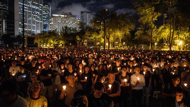 Les cérémonies en souvenir du massacre de la place Tian'anmen sont aujourd'hui prohibées à Hong Kong. [Keystone/AFP - Anthony Wallace]