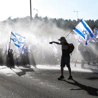 En Israël, l’opposition en réaction à l’adoption du projet de réforme de la justice ne faiblit pas. [EPA/Keystone - Abir Sultan]