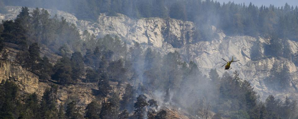 Plus de 100 hectares de forêts ont brûlé dans l'incendie de Bitsch (VS) (Image d'illustration). [Jean-Christophe Bott - Keystone]