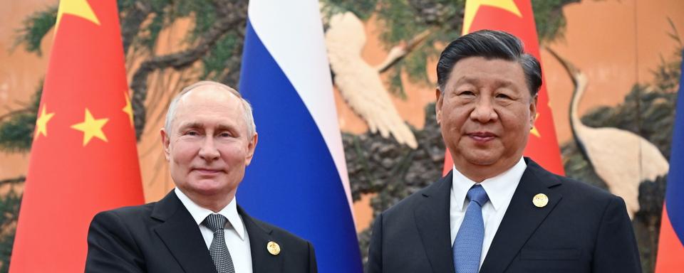 La rencontre entre Vladimir Poutine et Xi Jinping a débuté à Pékin [Keystone - Sergey Guneev /Sputnik/Kremlin/EPA]