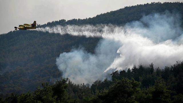 La Grèce entre dans son 7e jour de lutte contre les incendies, une amélioration près d'Athènes. [Keystone]