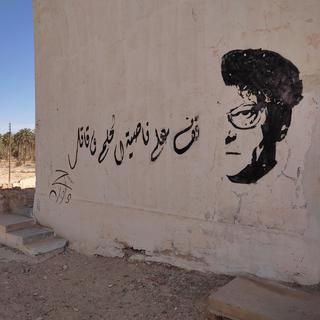 Le poète palestinien Mahmoud Darwich et une citation de lui incitant à ne jamais renoncer à la Révolution. [RTS - Brice Andlauer]