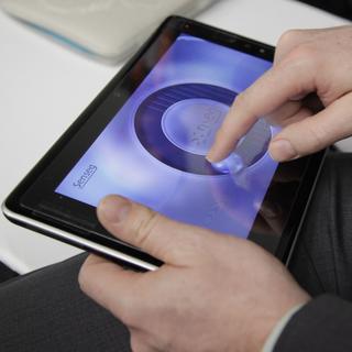 Une tablette avec écran tactile présentée lors d'un salon d'innovation technologique à Las Vegas, États-Unis (image d'illustration). [Keystone/AP Photo - Julie Jacobson]