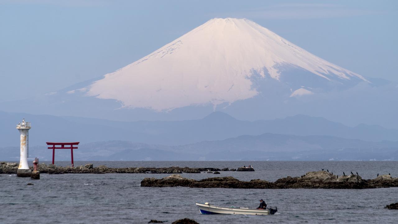 Le Mont Fuji est un emblème naturel du Japon. [Keystone - AP Photo/Kiichiro Sato]