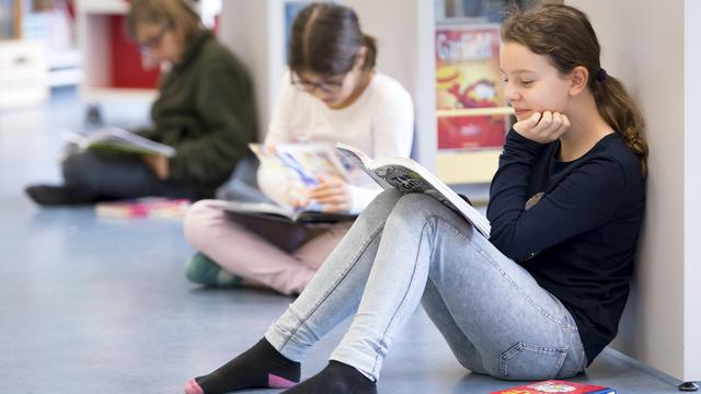 Les manuels scolaires suisses pourraient faire mieux en matière de racisme. [Keystone]