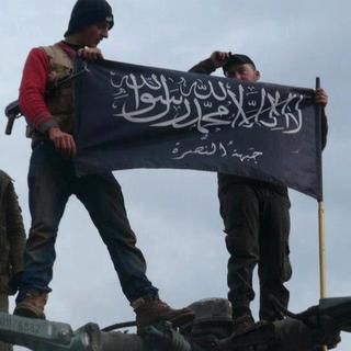 Un image datant de 2013 montre des combattants d'Al-Qaïda affiliés au Front al-Nosra en Syrie (image d'illustration). [Keystone/AP Photo - Edlib News Network ENN]