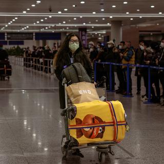 La Chine vient de lever les quarantaines obligatoires pour les voyageurs internationaux. [Keystone - EPA/Alex Plavevski]