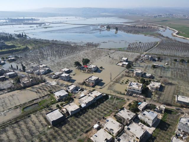 Vue du village inondé de Tloul, en Syrie. [Anadolu Agency/AFP - Izzeddin Kasim]