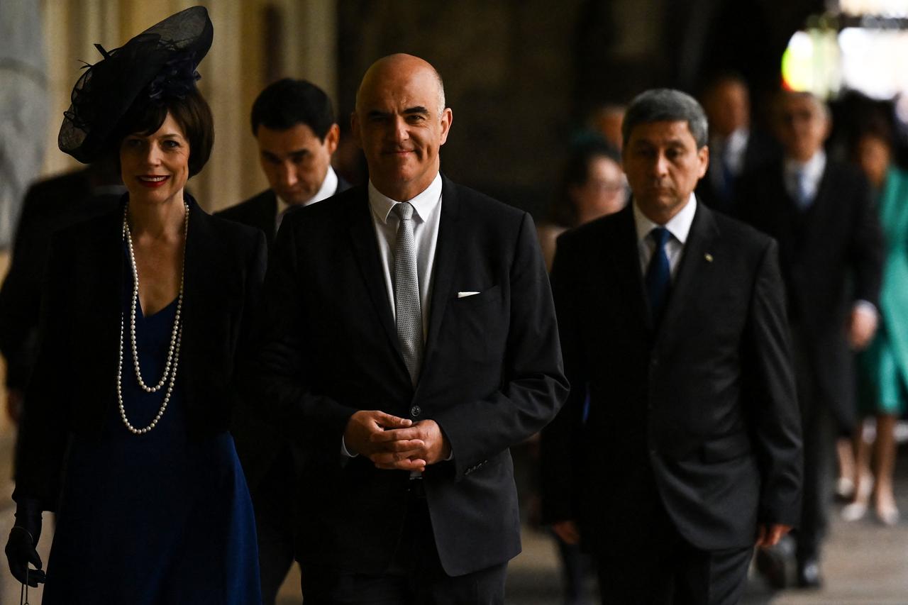 Le président de la Confédération Alain Berset et son épouse Muriel. [AFP - BEN STANSALL]