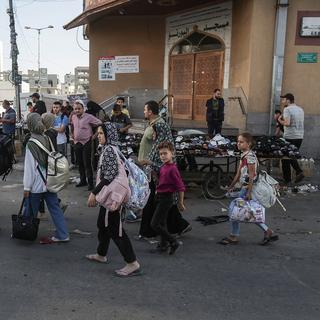 L'armée israélienne a admis vendredi que l'ordre d'évacuation donné plus tôt aux Palestiniens de fuir le nord de Gaza "prendrait du temps". [keystone - HAITHAM IMAD]