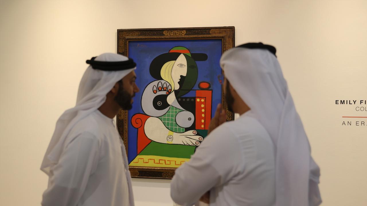 La "Femme à la montre" de Picasso en tournée mondiale avant sa mise aux enchères. [KEYSTONE - ALI HAIDER]