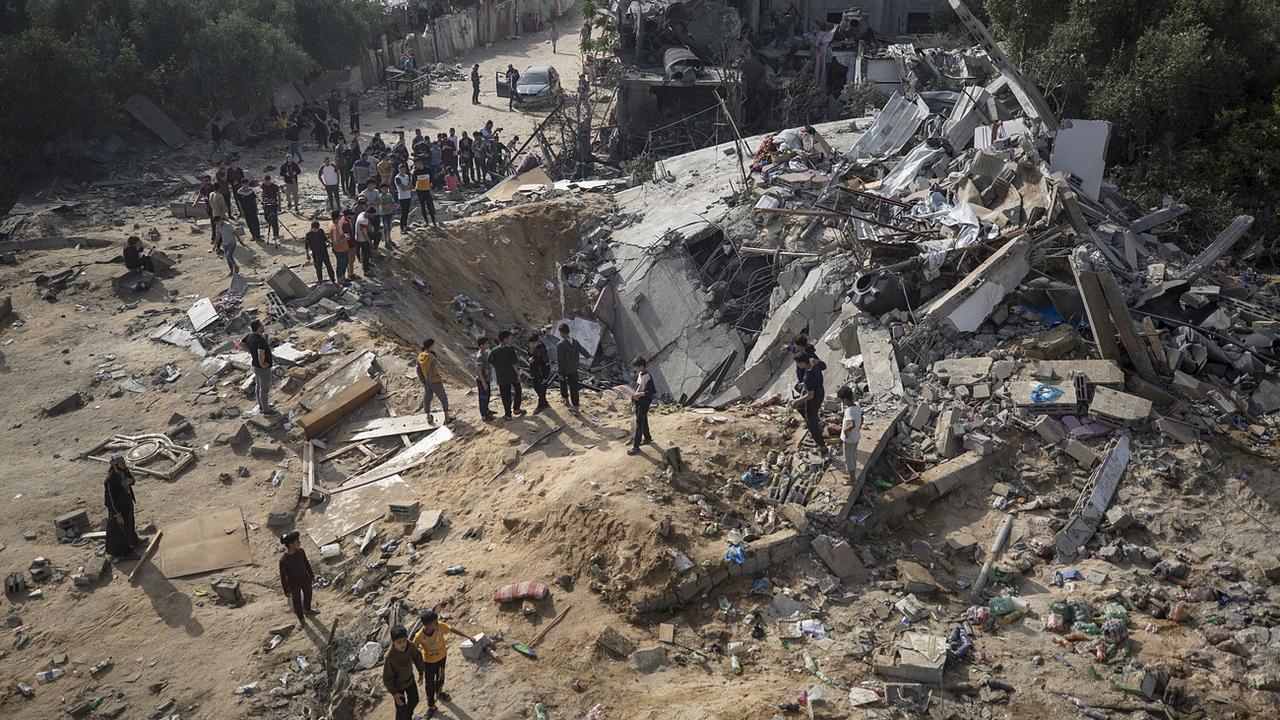 Les ruines d'une maison après les frappes israéliennes à Gaza du 12 mai 2023. [Keystone - Haitham Imad]