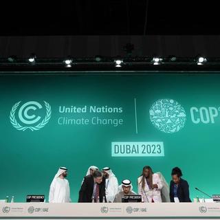 Les discussions se poursuivent à la COP28 pour tenter de trouver un compromis. [Keystone]