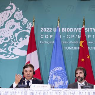 Huang Runqiu, Minister of Ecology and Environment of China and president of the COP15, responds to a question as Canadian Environment Minister Steven Guilbeault looks on during the closing news conference at the COP15 U.N. conference on biodiversity in Montreal, on Tuesday, Dec. 20, 2022. After a historic biodiversity agreement was reached, countries now face pressure to deliver on the promises. The most significant part of the global biodiversity framework is a commitment to protect 30% of land and water considered important for biodiversity by 2030. (Paul Chiasson/The Canadian Press via AP) [The Canadian Press via AP - Paul Chiasson]
