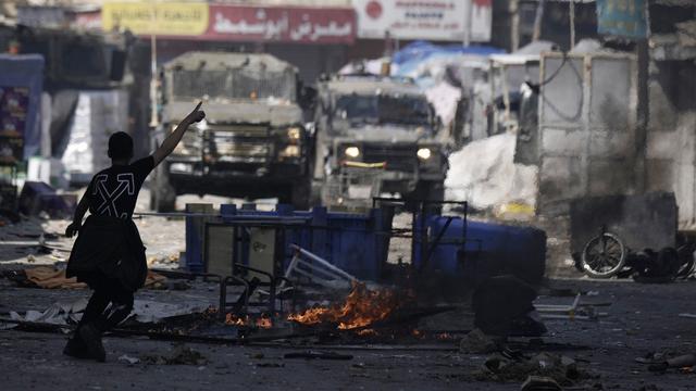 De jeunes Palestiniens ont affronté les forces israéliennes à Naplouse, 22.02.2023. [AP/Keystone - Majdi Mohammed]