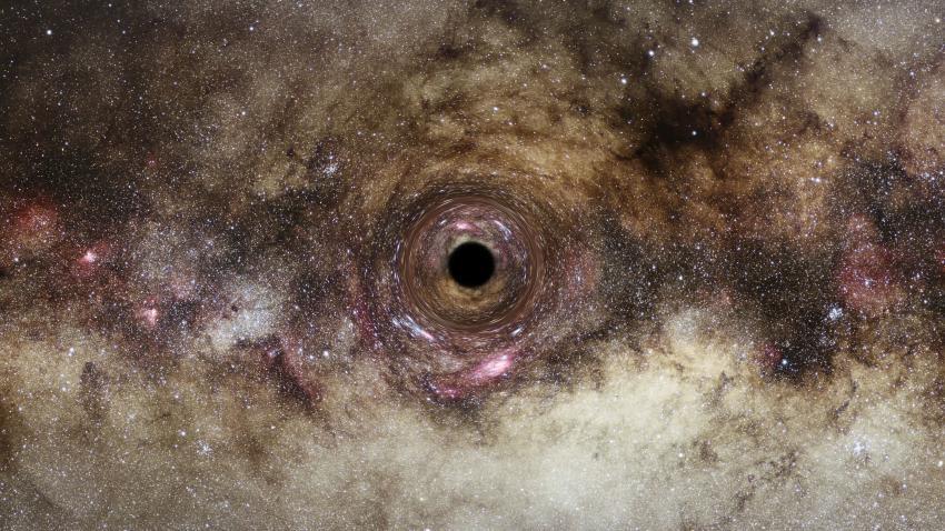 Illustration artistique d'un trou noir: son champ gravitationnel intense déforme l'espace qui l'entoure. Cela déforme les images lumineuses en arrière-plan, alignées presque directement derrière lui, en anneaux circulaires distincts. Cet effet de lentille gravitationnelle offre une méthode d'observation pour déduire la présence de trous noirs et mesurer leur masse, en fonction de l'importance de la courbure de la lumière. [CC BY 4.0 - ESA/Hubble, Digitized Sky Survey, Nick Risinger (skysurvey.org), N. Bartmann]