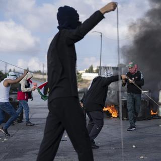 Reportage sur la colère des Palestiniens de Ramallah. [Keystone - AP Photo/Nasser Nasser]