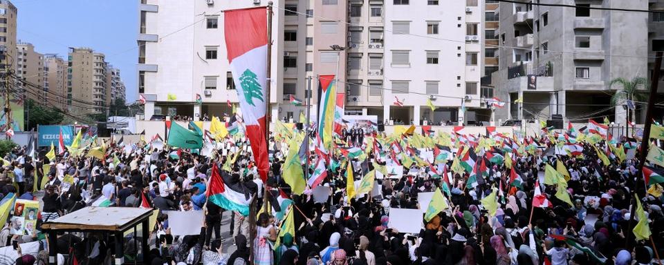 Des partisans du Hezbollah rassemblés à Beyrouth le 13 octobre 2023. [AFP - Anwar Amro]