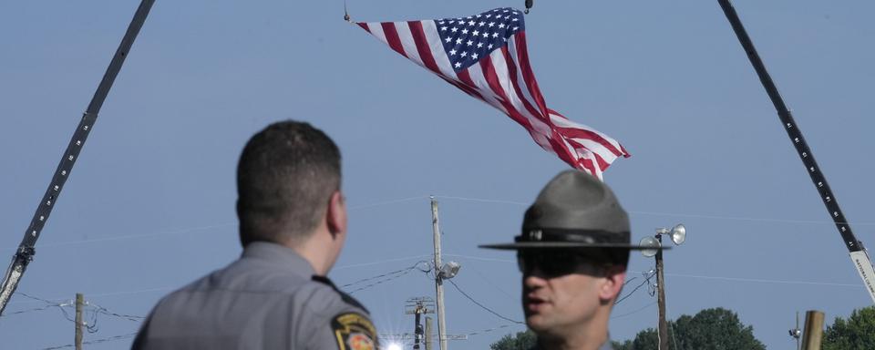 Des policiers patrouillent près du rally pro-Trump. [Keystone/AP Photo - Sue Ogrocki]