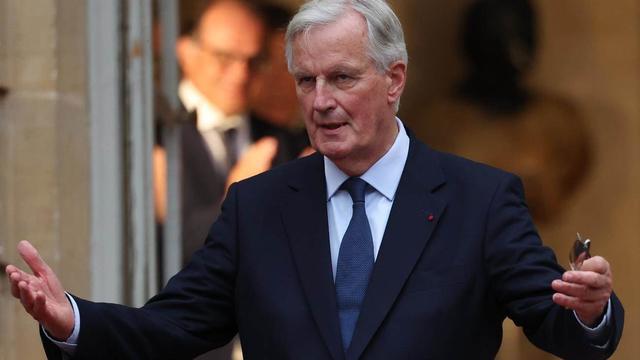 M.Barnier, qui sera reçu en début de soirée par E.Macron, envisage un gouvernement de 38 ministres. [Keystone]