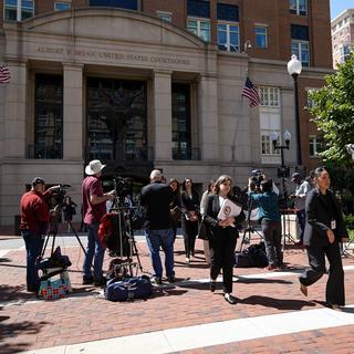 Lawyers and legal assistants leave the U.S. District Court for the Eastern District of Virginia for a lunch break in the Department of Justice's antitrust trial against tech giant Google, Monday, Sept. 9, 2024, in Alexandria, Va. [AP Photo/Keystone - Stephanie Scarbrough]