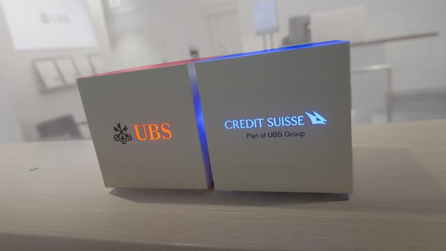 La fusion est effective entre UBS SA et Credit Suisse SA. [Keystone - TI-PRESS/PABLO GIANINAZZ]