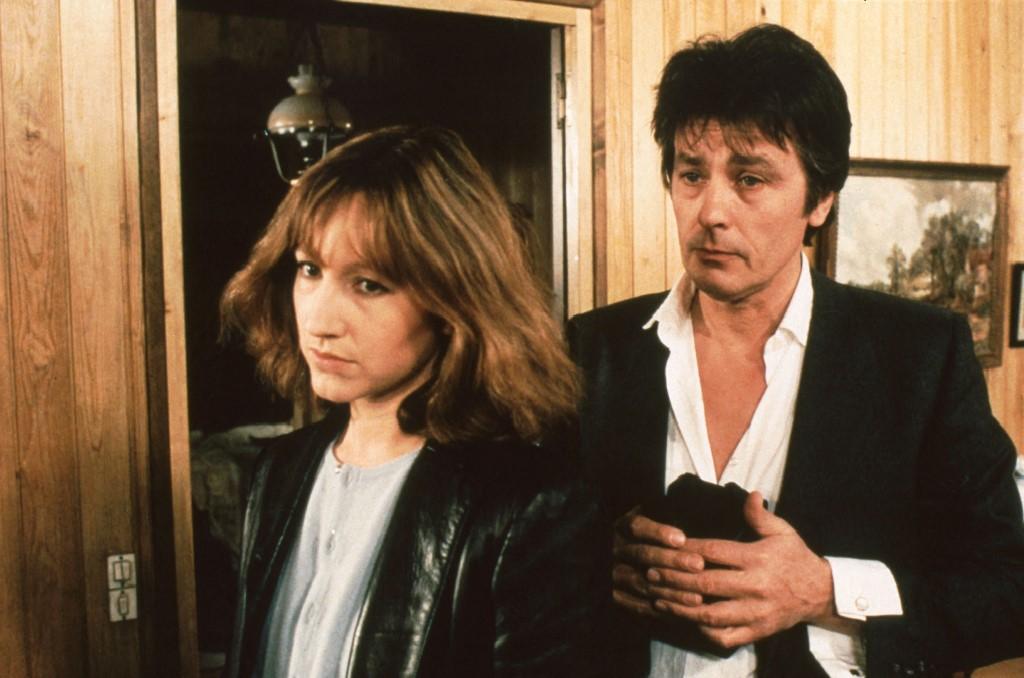 Alain Delon e Nathalie Baye em "Nossa história" (1984) [Collection ChristopheL via AFP - ADEL PRODUCTIONS /SARA FILMS]