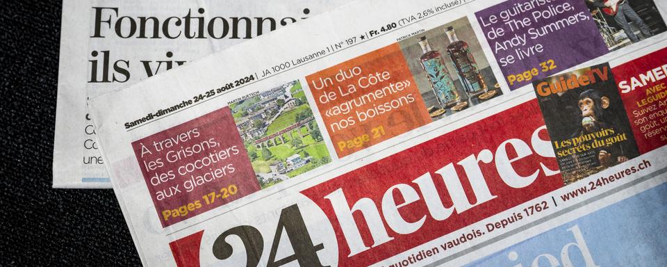 Les journaux du groupe Tamedia Publications Romandes, 24 heures et Tribune de Genève. [Keystone - Jean-Christophe Bott]