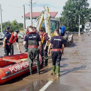 A handout photo made available by the Romanian General Inspectorate for Emergency Situations (IGSU) shows Romanian rescuers preparing their gear for operations in the flood-affected village of Pechea, near Galati city, Romania, 14 September 2024. Four people have died in Galati County and about 5,000 homes have been damaged as a result of flooding caused by heavy rains brought by Cyclone Boris. Romanian authorities announced that operations in the affected areas are challenging due to floods blocking several roads. Hydrologists have issued a red flood code for the Siret (Galati county) and Prut rivers (Vaslui county). EPA/ROMANIAN GENERAL INSPECTORATE FOR EMERGENCY SITUATIONS HANDOUT -- MANDATORY CREDIT -- BEST QUALITY AVAILABLE -- HANDOUT EDITORIAL USE ONLY/NO SALES [Keystone - Romanian General Inspectorate for Emergency Situations (IGSU)]