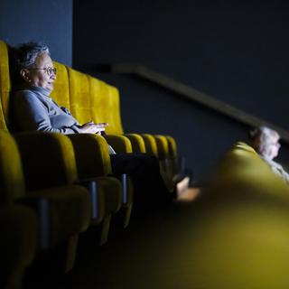 Les salles de cinéma restent moins fréquentées qu'avant le Covid en Suisse. [Keystone - Michael Buholzer]