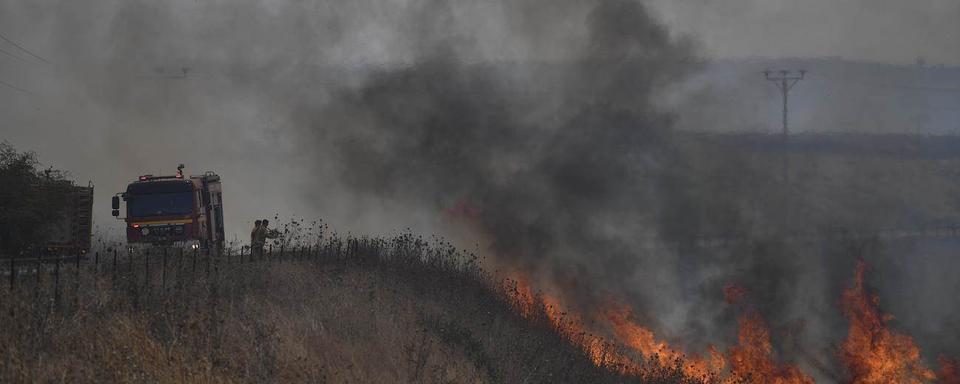 Les roquettes du Hezbollah ont provoqué des incendies sur le plateau du Golan occupé par Israël. [Keystone]