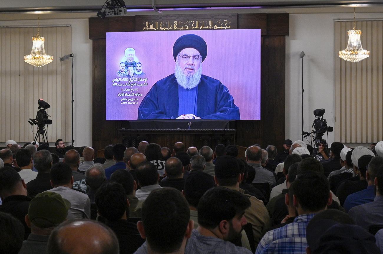 Le chef du Hezbollah libanais Hassan Nasrallah lors d'un discours télévisé. [KEYSTONE - WAEL HAMZEH]