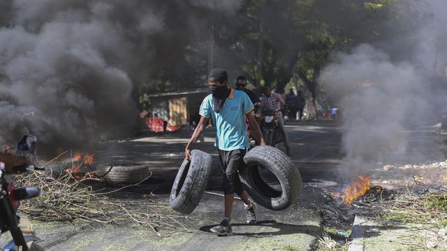 Vingt-huit membres de gangs tués par la police et des habitants de Port-au-Prince. [KEYSTONE - ODELYN JOSEPH]