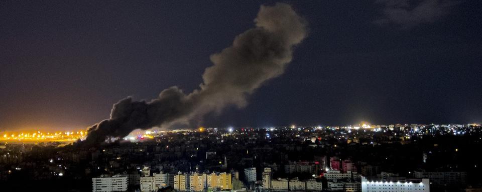 Smoke rises from an Israeli airstrike that hit the southern suburb of Beirut, Lebanon, Tuesday, Oct. 1, 2024. [AP Photo/Keystone - Hussein Malla]