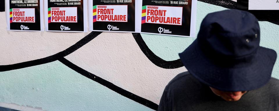 Des affiches du Nouveau Front Populaire. [Teresa Suarez - EPA/Keystone]