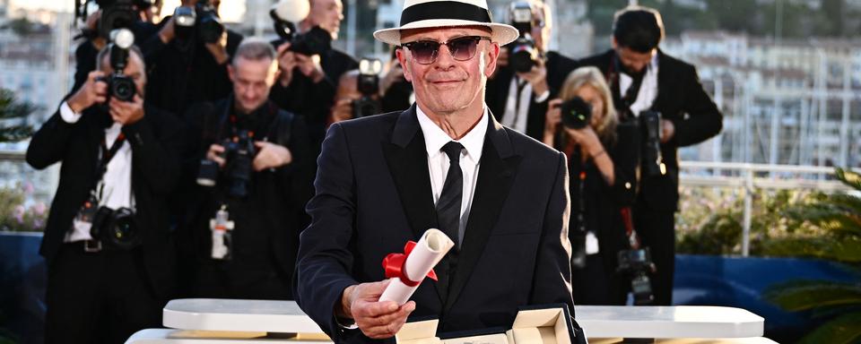 Le réalisateur Jacques Audiard lors de la 77e édition du Festival du Film de Cannes le 25 mai 2024. [AFP - LOIC VENANCE]