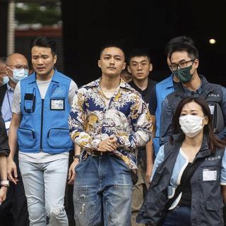 A Hong Kong, 14 militants prodémocratie ont été reconnus coupables de "subversion". [Keystone]