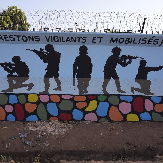 A mural reading " remain vigilant and mobilised" is seen in Ouagadougou, Burkina Faso, Wednesday March 1, 2023, in a region shaken by extremist uprisings and military coups. [AP Photo/Keystone]