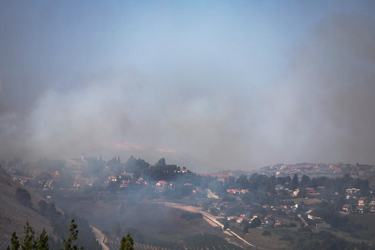 Des frappes israéliennes sur le sol libanais en riposte aux attaques du Hezbollah. [KEYSTONE - ATEF SAFADI]