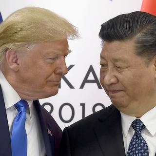 Rencontre entre Donald Trump et Xi Jinping durant le sommet du G20 en 2019, à Osaka (Japon). [AP Photo/ Keystone - Susan Walsh]