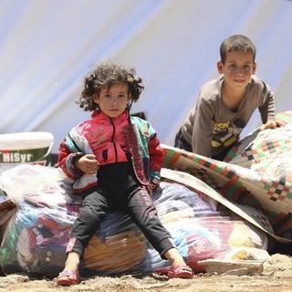 Une photographie prise par l'UNICEF d'une famille fuyant l'escalade des conflits près de la frontière du sud-ouest de la Syrie. 21 juin 2018. [EPA/KEYSTONE - ALAA AL-FAQIR]