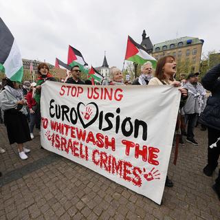 Israël a utilisé l'Eurovision pour avoir une bonne image sur la scène internationale, malgré l'invasion militaire de Gaza et le risque de génocide envers les Palestiniens. [Keystone/AP Photo - Martin Meissner]