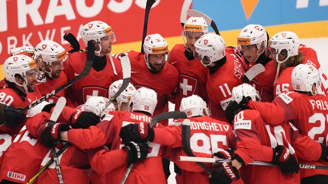 Hockey: la Suisse bat l'Allemagne et s'offre une place en demi-finales des Championnats du monde. [AP Photo/Keystone - Darko Vojinovic]