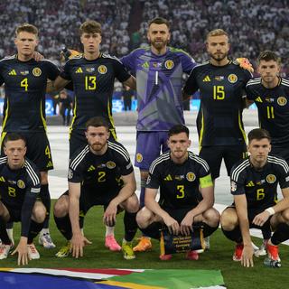 L'équipe écossaise de football pose pour en groupe lors de l'Euro 2024 en Allemagne. [Keystone/AP Photo - Frank Augstein]